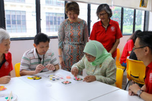 Caritas Singapore Welcomes Mdm Halimah Yacob, President of Singapore, at Agape Village 7 5 Mdm President at the Mamre Oaks Day Activity Centre with member Kee Yong white