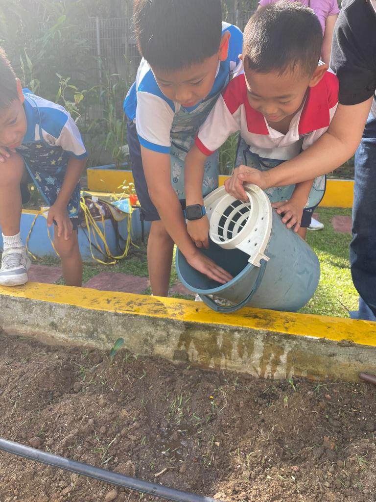 St Gabriels Foundation Watering seeds 1